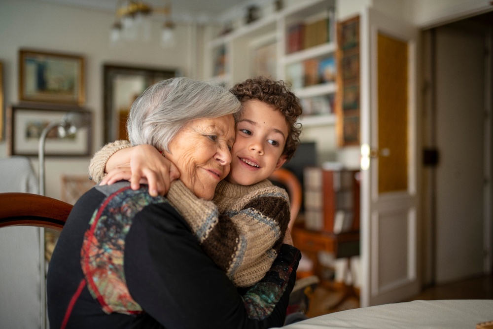 A woman hugging her grandchild. 