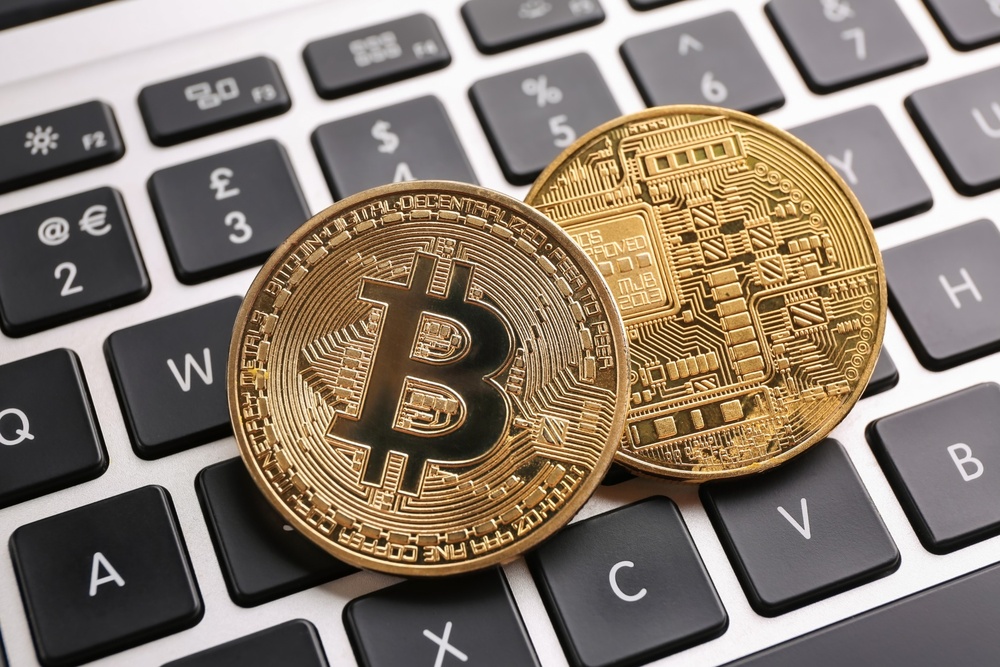 Depiction of physical bitcoins on a keyboard. 